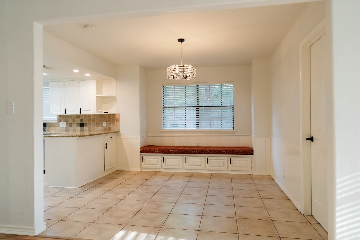 13002 Cedarhurst Circle Austin, TX 78729 - Photo 15 of 40 a bathroom with a tub sink and cabinets