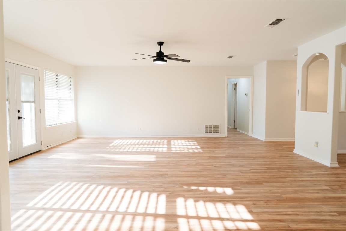 13002 Cedarhurst Circle Austin, TX 78729 - Photo 18 of 40 a view of empty room with wooden floor and fan