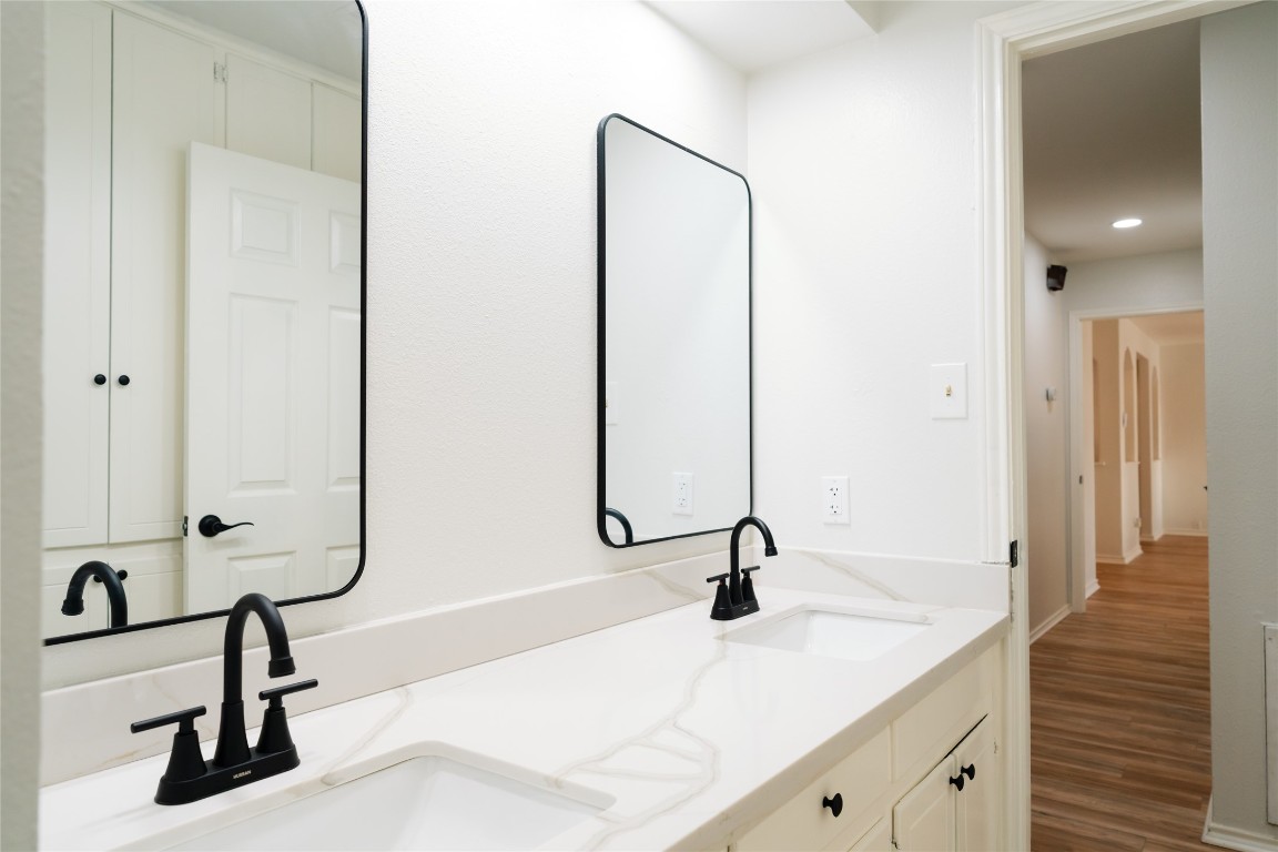 13002 Cedarhurst Circle Austin, TX 78729 - Photo 28 of 40 a view of a bathroom with a sink and mirror