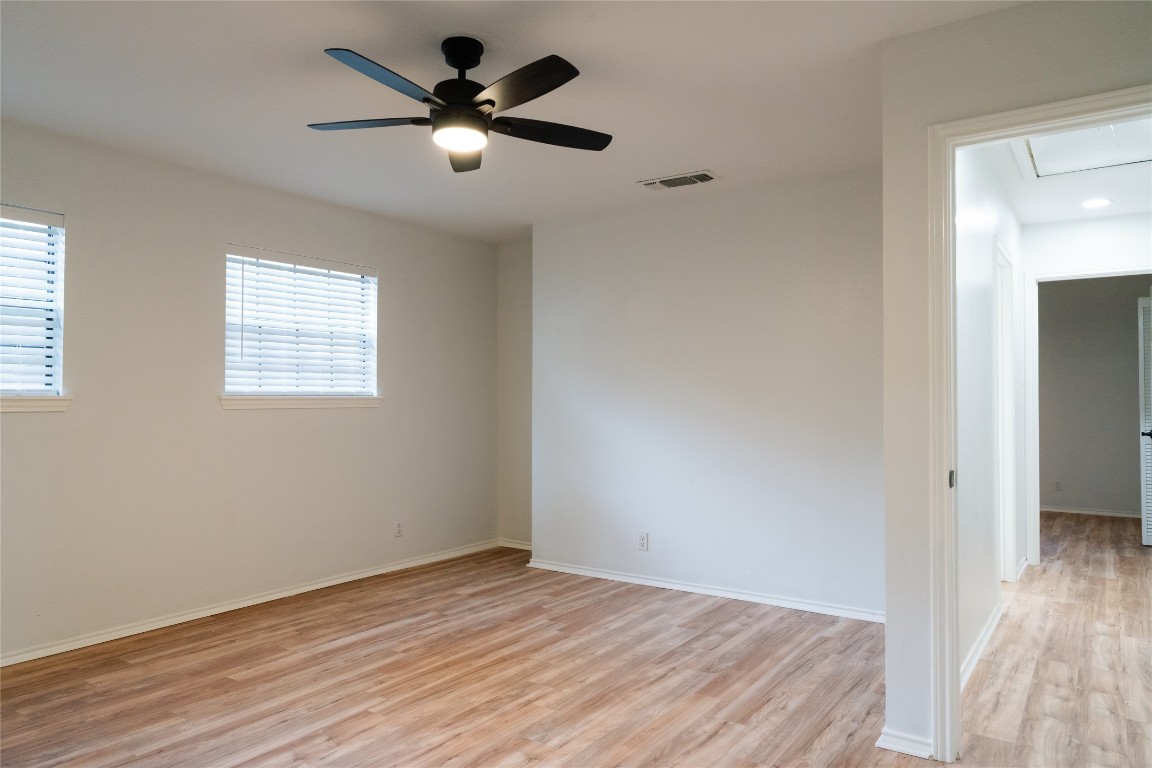 13002 Cedarhurst Circle Austin, TX 78729 - Photo 33 of 40 wooden floor in an empty room with a window