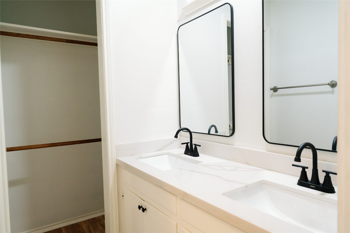 13002 Cedarhurst Circle Austin, TX 78729 - Photo 35 of 40 a bathroom with a sink and mirror
