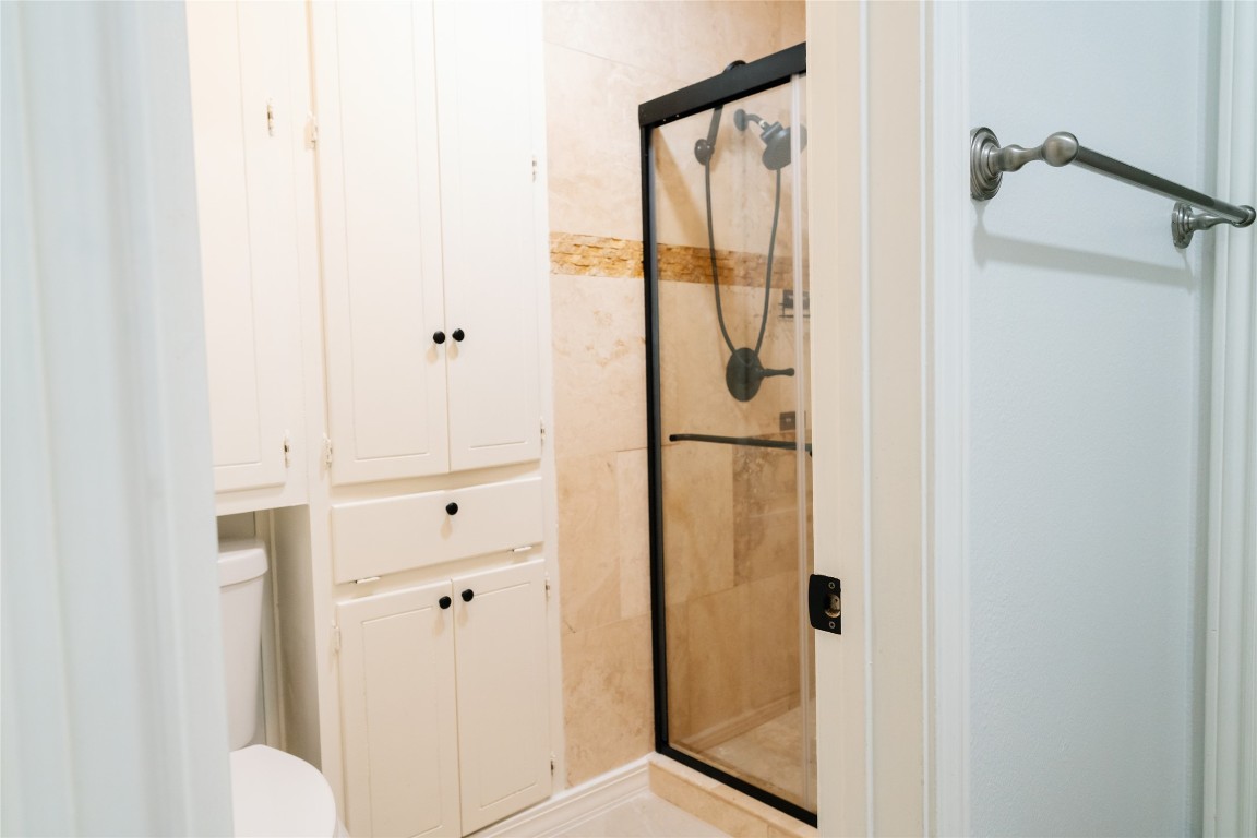 13002 Cedarhurst Circle Austin, TX 78729 - Photo 36 of 40 a bathroom with a shower and a sink