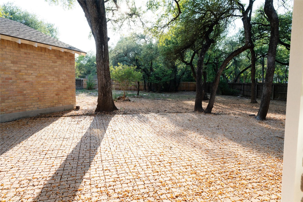 13002 Cedarhurst Circle Austin, TX 78729 - Photo 38 of 40 a view of a backyard with large trees