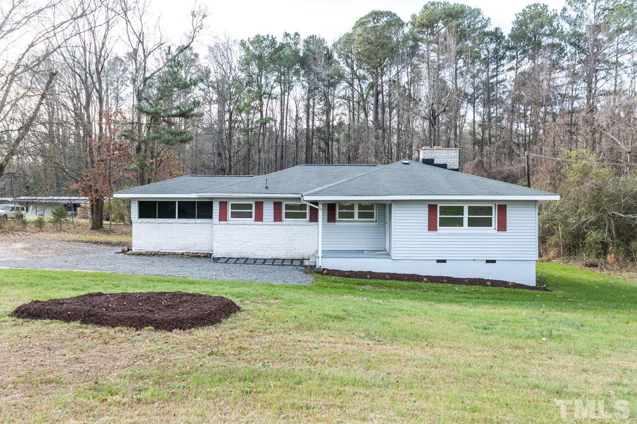 1309 Legend Road Raleigh, NC 27603 - Photo 1 of 27 front view of a house and a yard