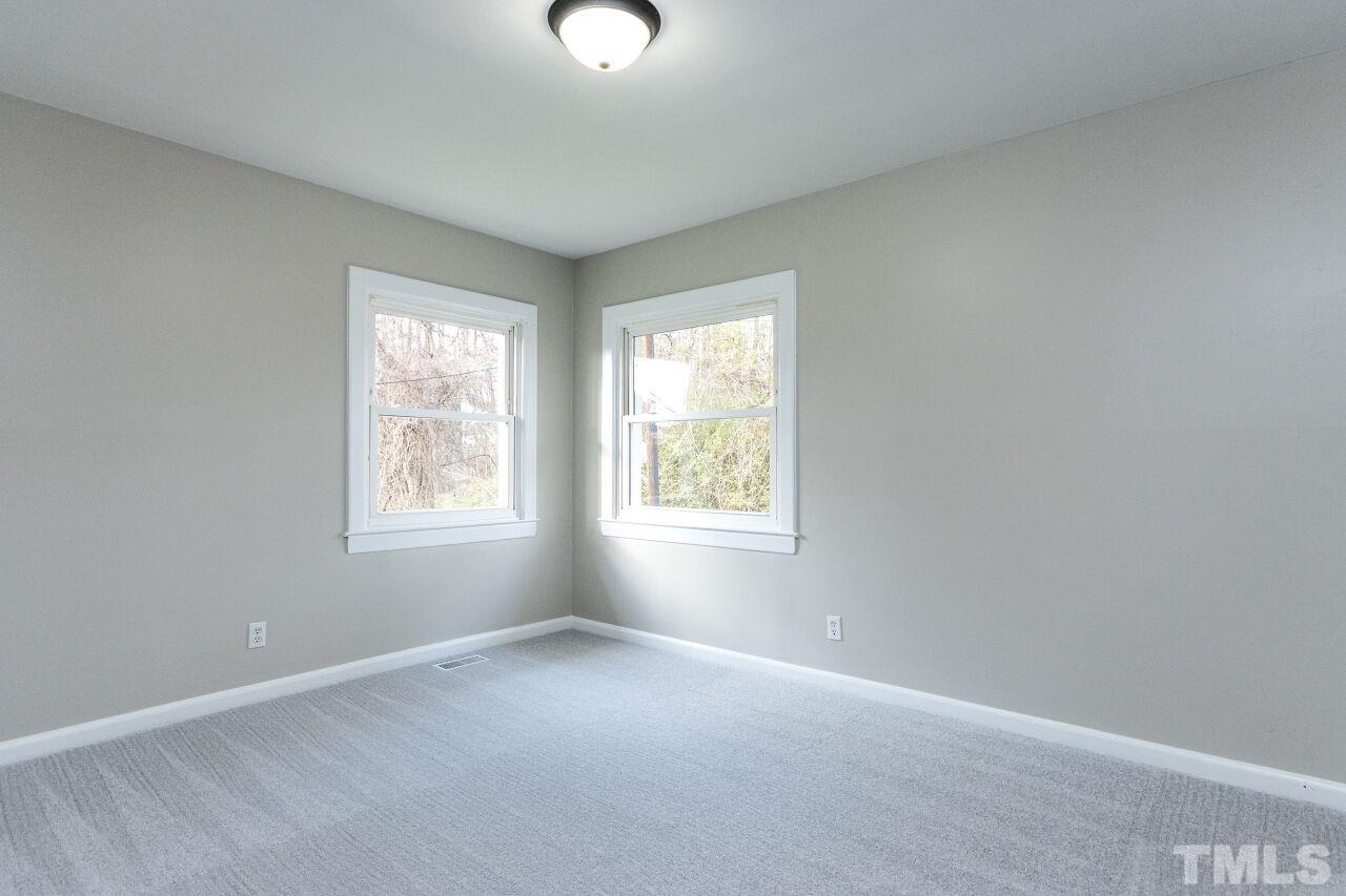 1309 Legend Road Raleigh, NC 27603 - Photo 16 of 27 an empty room with windows