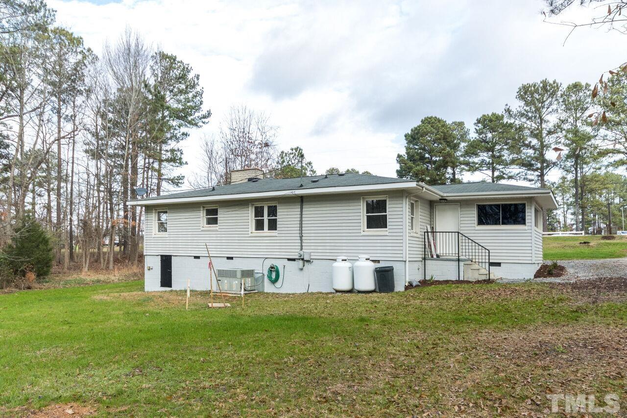 1309 Legend Road Raleigh, NC 27603 - Photo 25 of 27 a view of a house with a yard