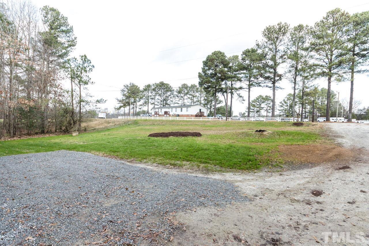 1309 Legend Road Raleigh, NC 27603 - Photo 4 of 27 a view of a yard with large trees