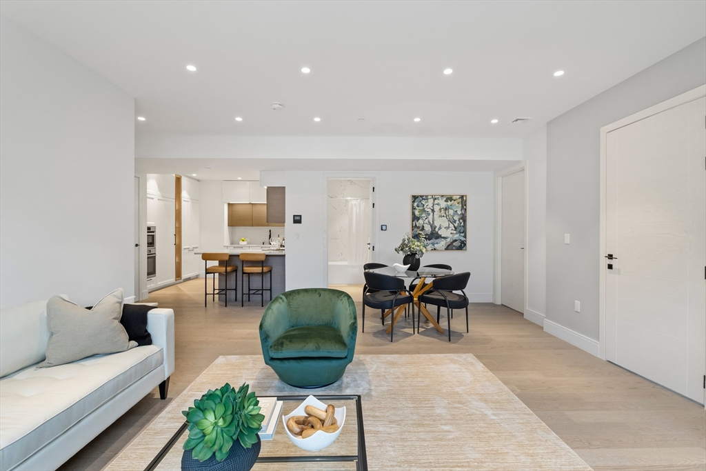 69 Walnut Street, Unit 10A Brookline, MA 02445 - Photo 5 of 17 a living room with furniture