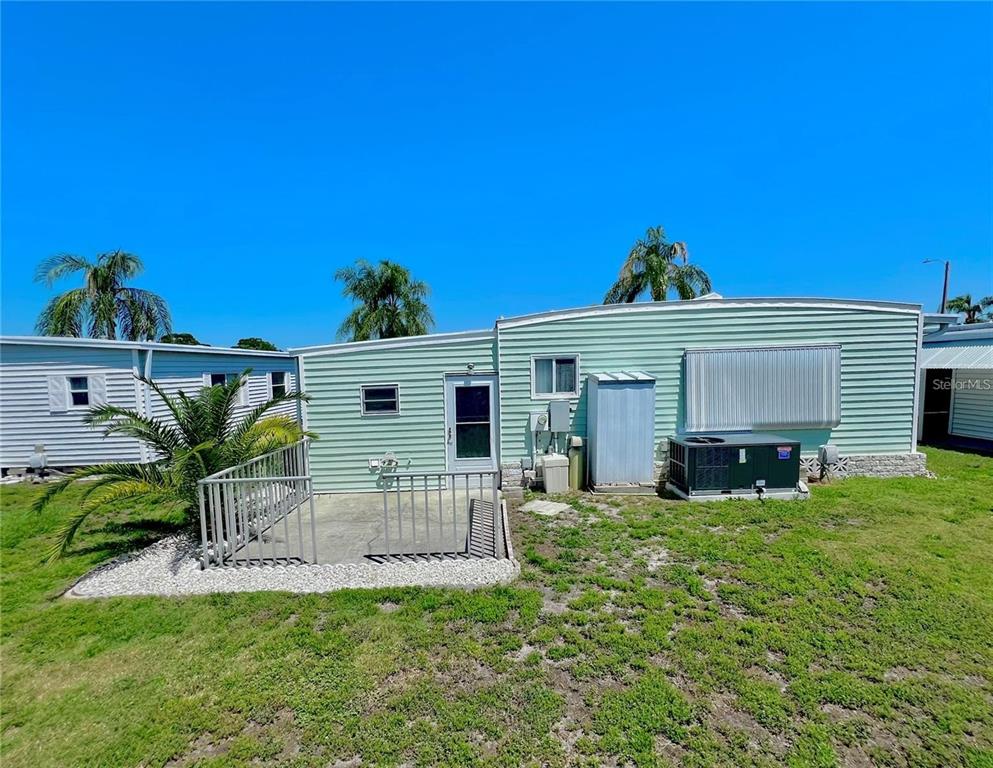 1100 South Belcher Road, Unit 772 Largo, FL 33771 - Photo 6 of 84 a view of a house with a yard
