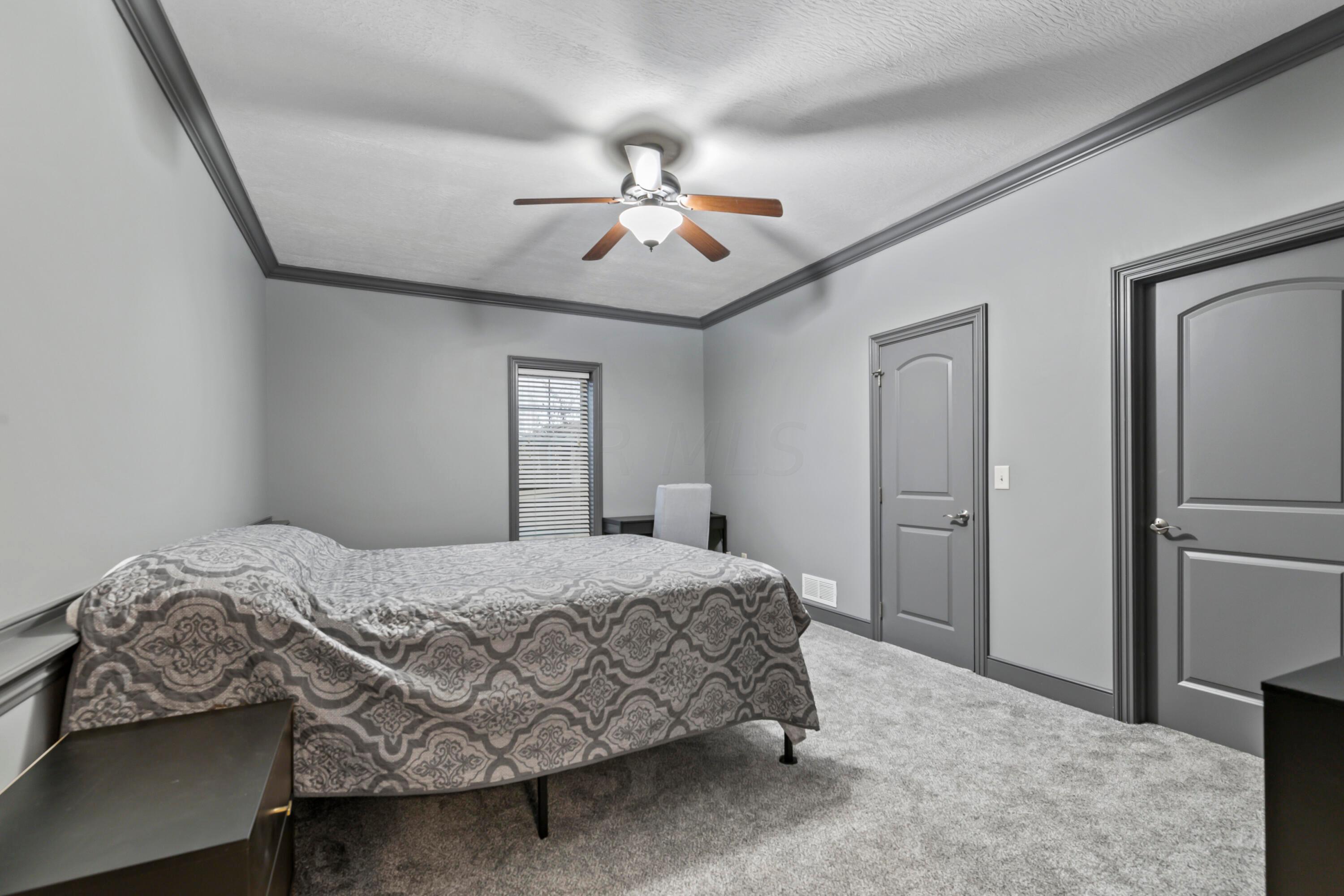 6043 Dublin Road Delaware, OH 43015 - Photo 60 of 98 • New grey carpet ~ 2021
• Grey painted walls
• Crown molding
• Lighted ceiling fan
• Egress window
• Single door closet
