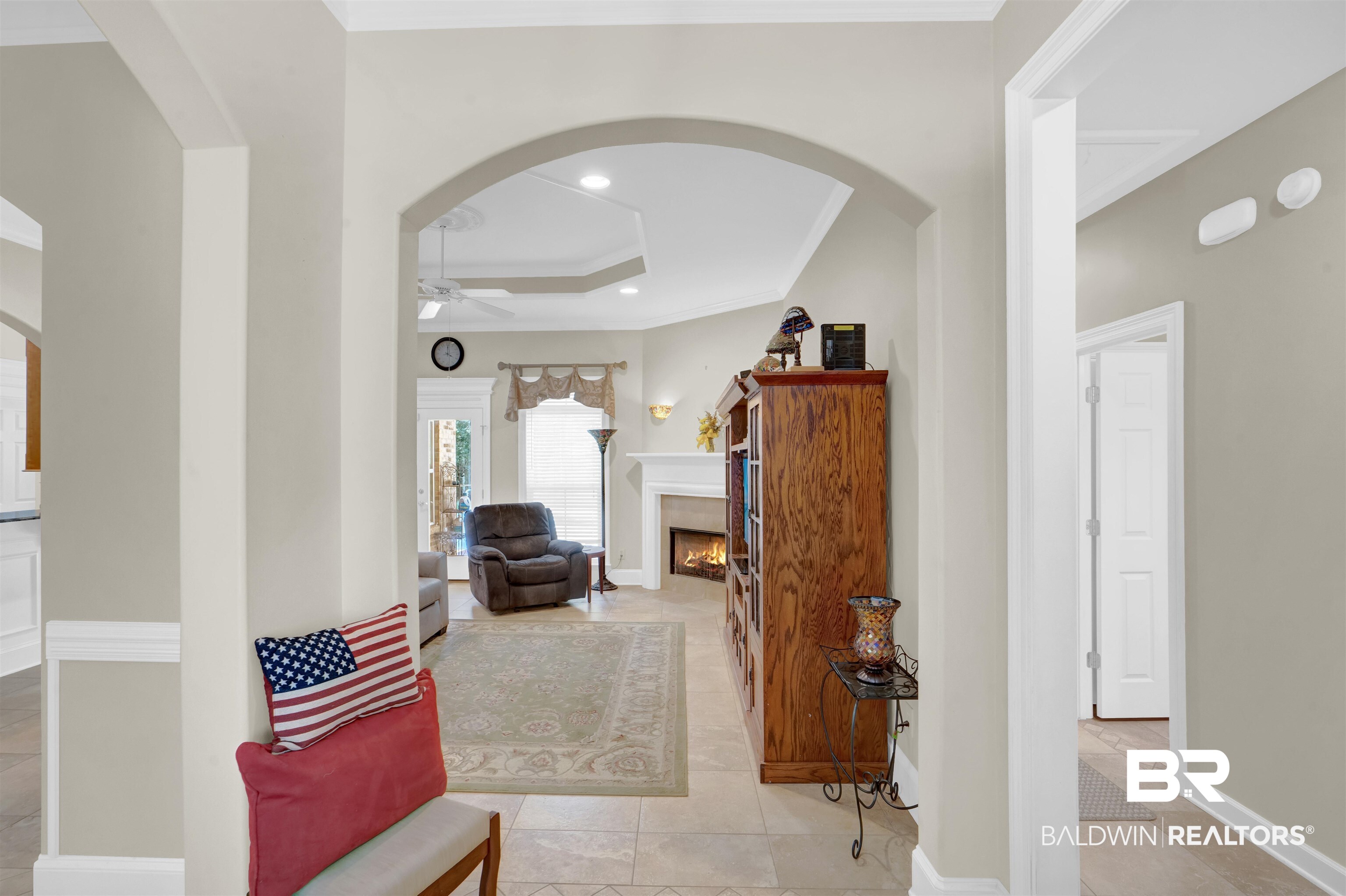 10951 Driver Court Fairhope, AL 36532 - Photo 13 of 46 Hallway with ornamental molding, light tile patterned floors, and a raised ceiling