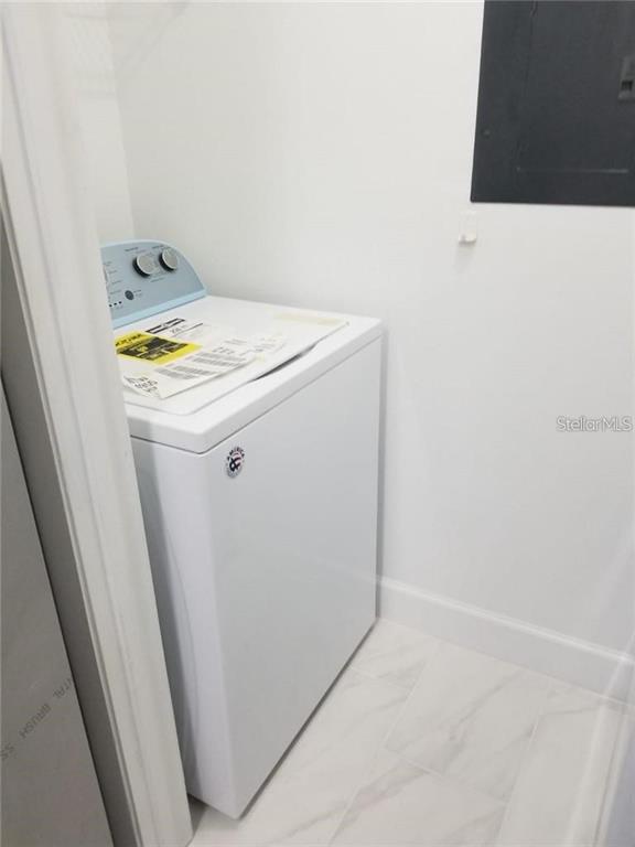 236 Afton Square, Unit 201 Altamonte Springs, FL 32714 - Photo 11 of 42 a utility room with dryer and washer