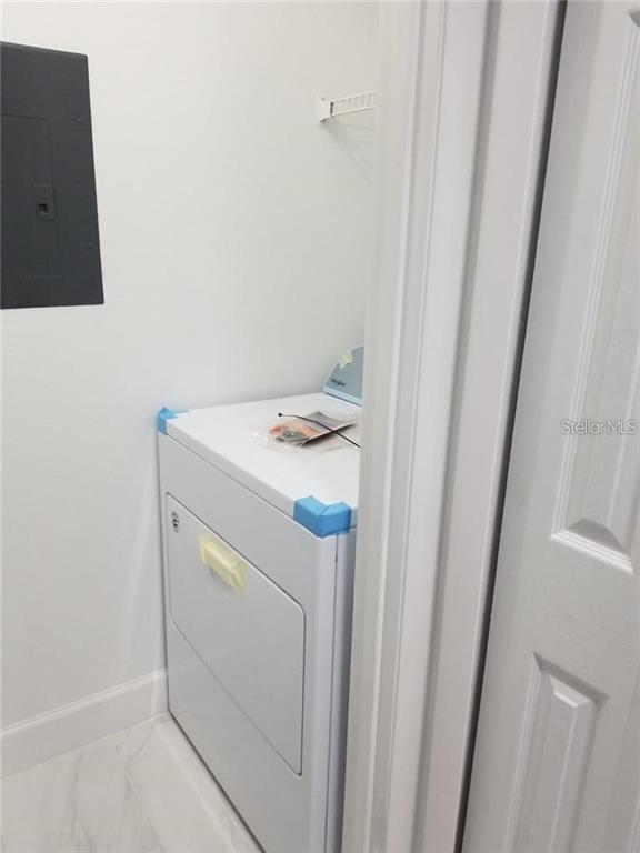 236 Afton Square, Unit 201 Altamonte Springs, FL 32714 - Photo 12 of 42 a utility room with dryer and washer