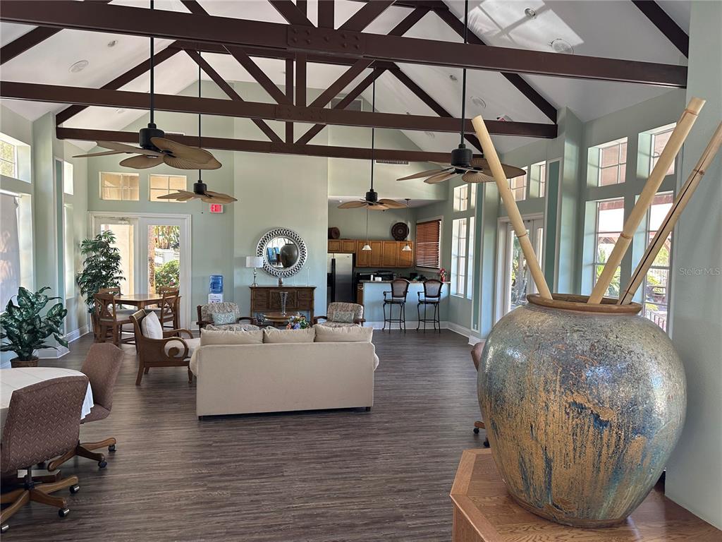 236 Afton Square, Unit 201 Altamonte Springs, FL 32714 - Photo 25 of 42 a living room with furniture and a chandelier