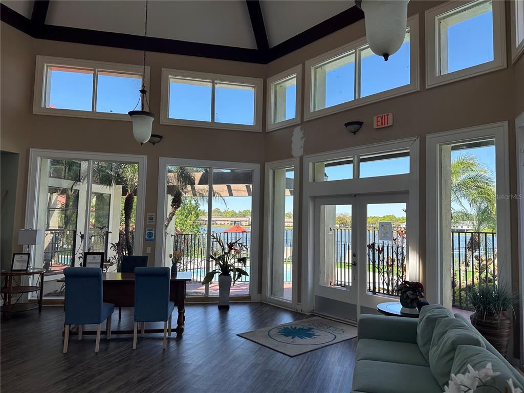 236 Afton Square, Unit 201 Altamonte Springs, FL 32714 - Photo 26 of 42 a living room with furniture fireplace and floor to ceiling windows