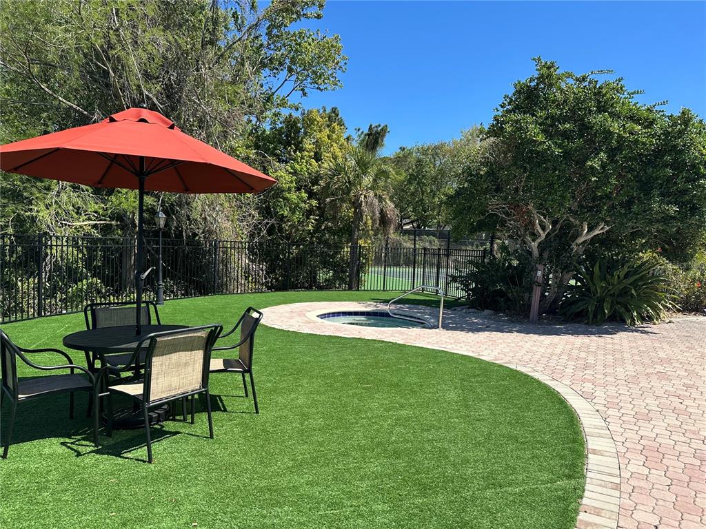 236 Afton Square, Unit 201 Altamonte Springs, FL 32714 - Photo 32 of 42 a garden view with a seating space