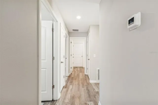 a bathroom with a sink a toilet a shower and a mirror