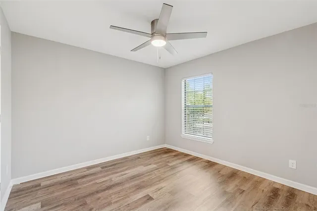 a view of a kitchen with a sink and a stove top oven