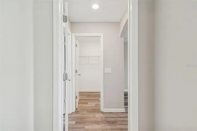 a kitchen with kitchen island a sink appliances and cabinets
