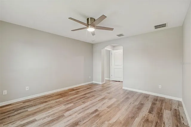 a view of kitchen with sink and wooden floor