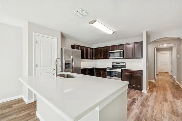 an aerial view of a residential houses with outdoor space swimming pool and lake view