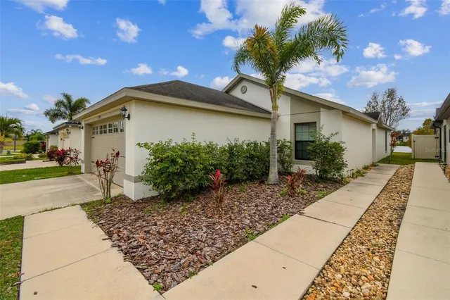 a view of a hallway with wooden floor and closet