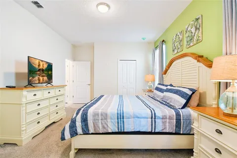 a bathroom with a double vanity sink toilet and shower