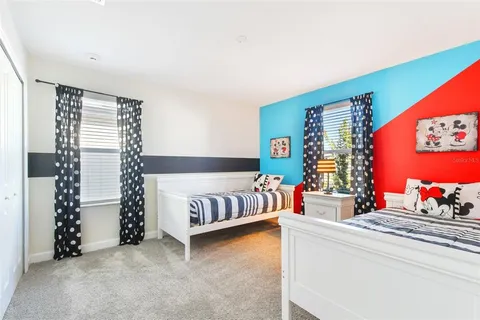 a view of a room with furniture and a window