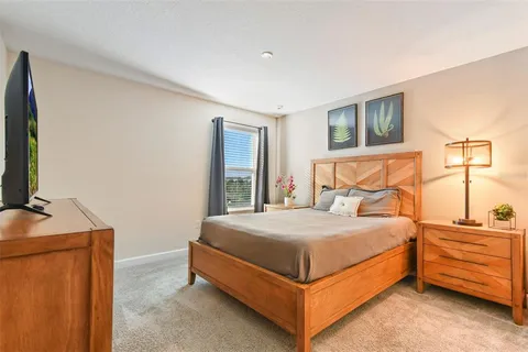 a bedroom with a bed and a couch