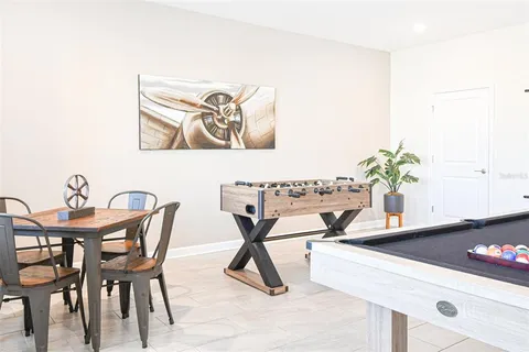 a living room with furniture and a large mirror