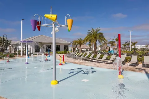 a view of a swimming pool with a yard