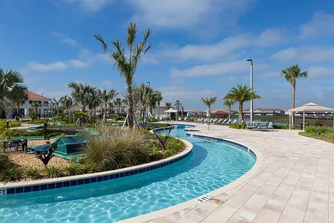 a view of a swimming pool with a table and chairs