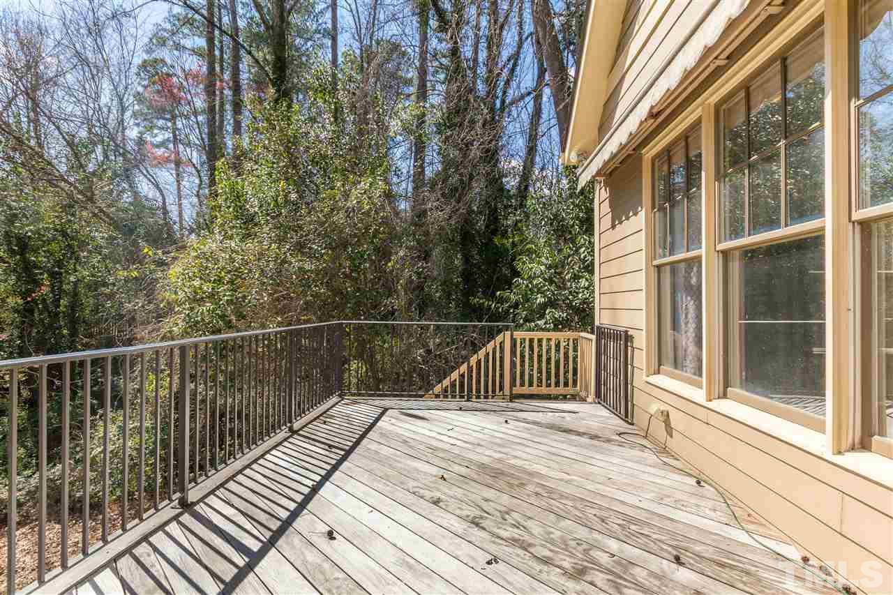 2341 Lyon Street Raleigh, NC 27608 - Photo 22 of 25 a view of balcony with wooden floor and fence