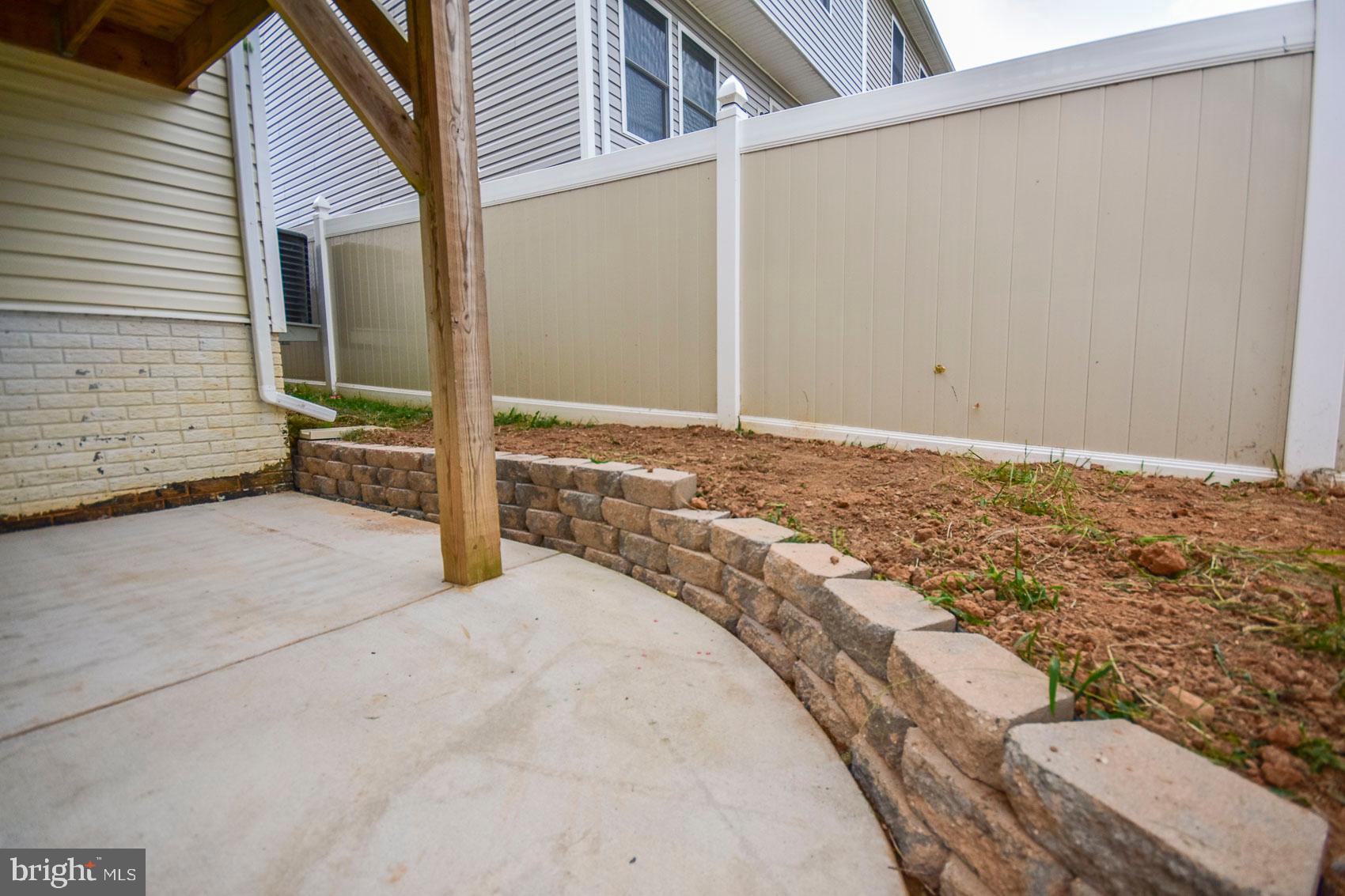 417 East 6th Avenue Ranson, WV 25438 - Photo 42 of 47 New stone retaining wall