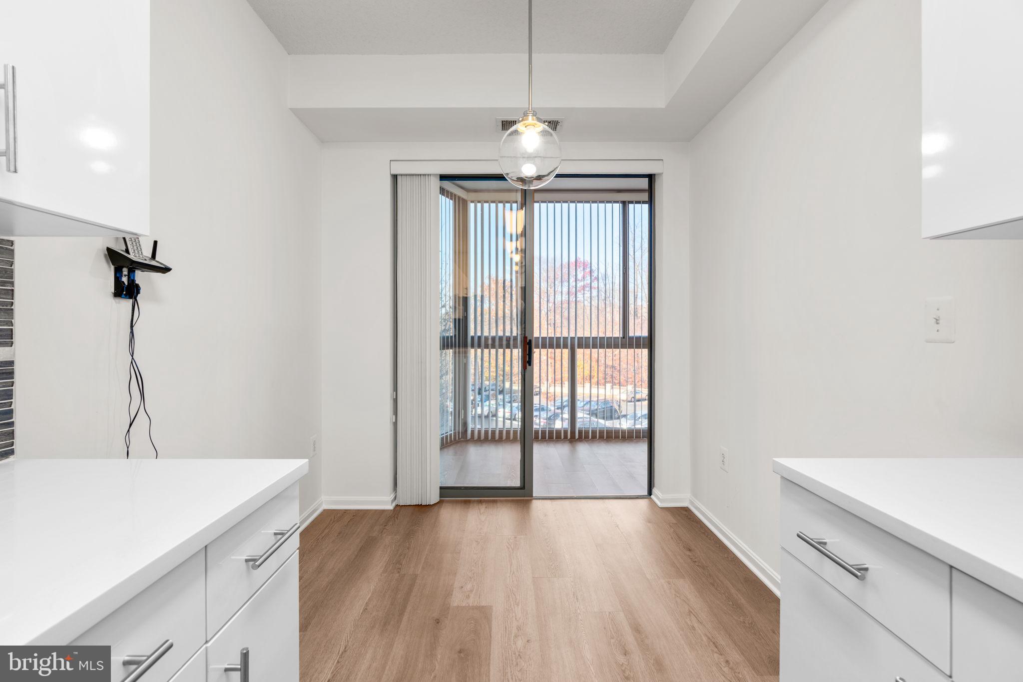 2901 South Leisure World Boulevard, Unit 233 Silver Spring, MD 20906 - Photo 14 of 43 a view of an empty room with a window