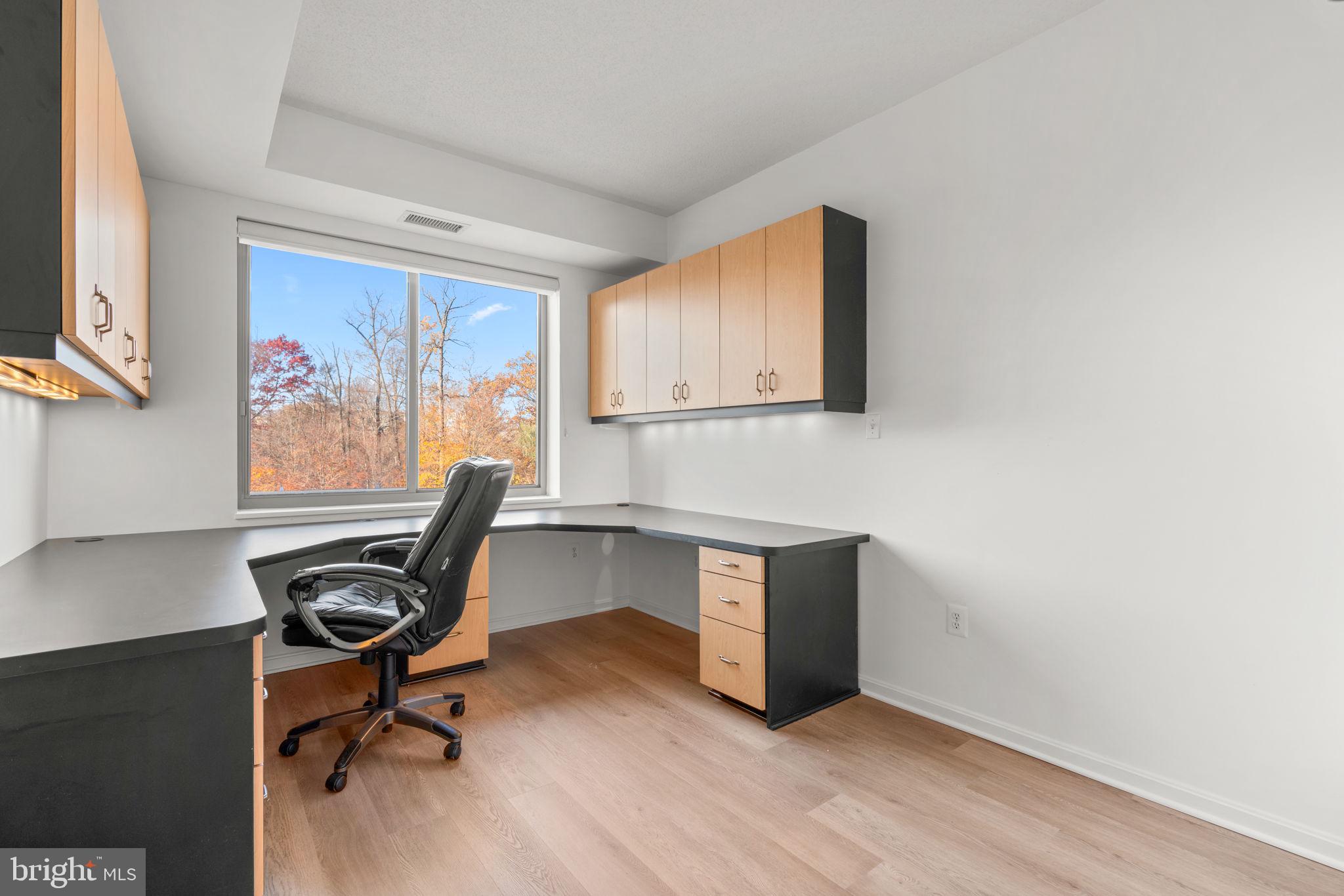 2901 South Leisure World Boulevard, Unit 233 Silver Spring, MD 20906 - Photo 15 of 43 a view of a workspace with furniture and a window