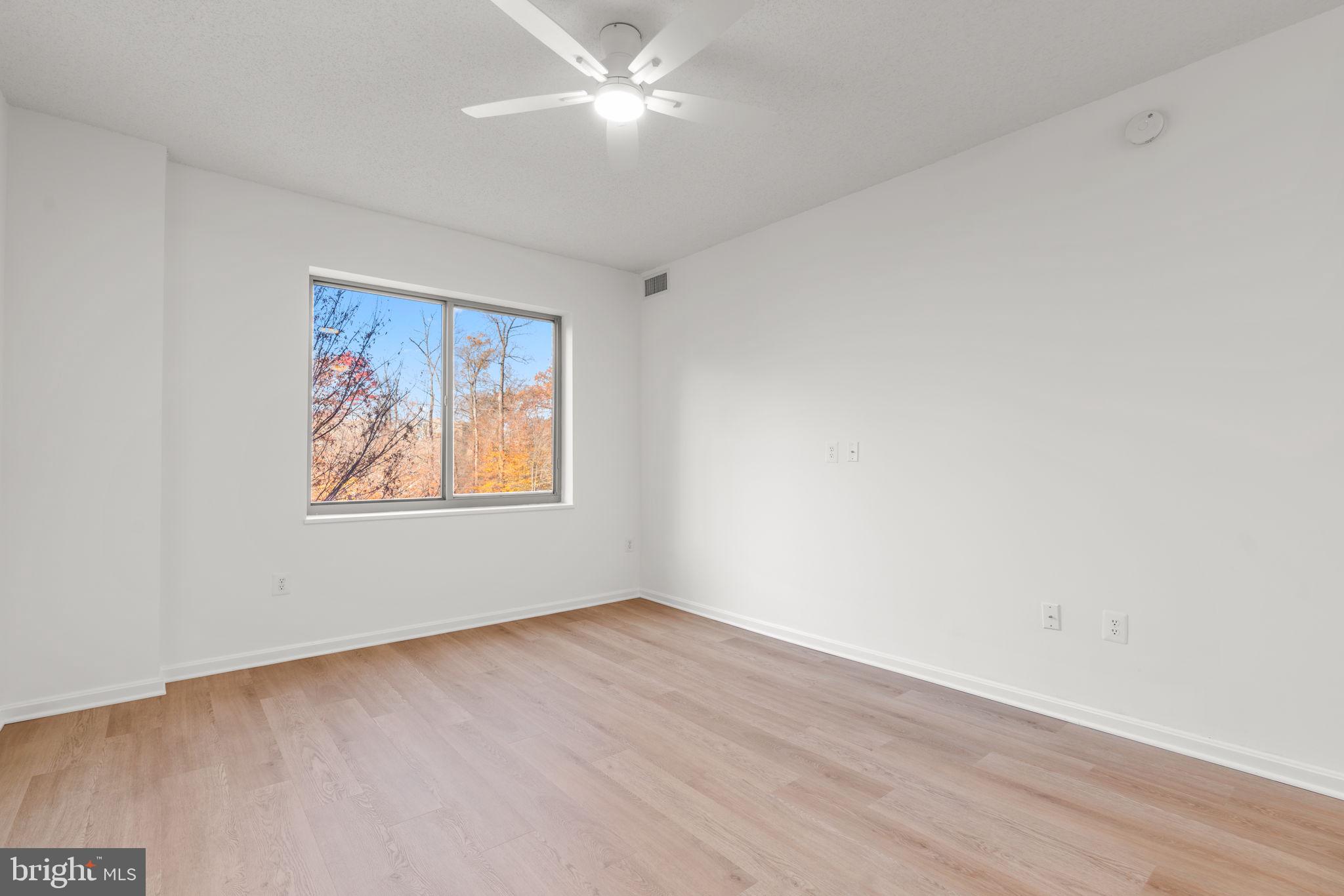 2901 South Leisure World Boulevard, Unit 233 Silver Spring, MD 20906 - Photo 22 of 43 a view of an empty room with a window
