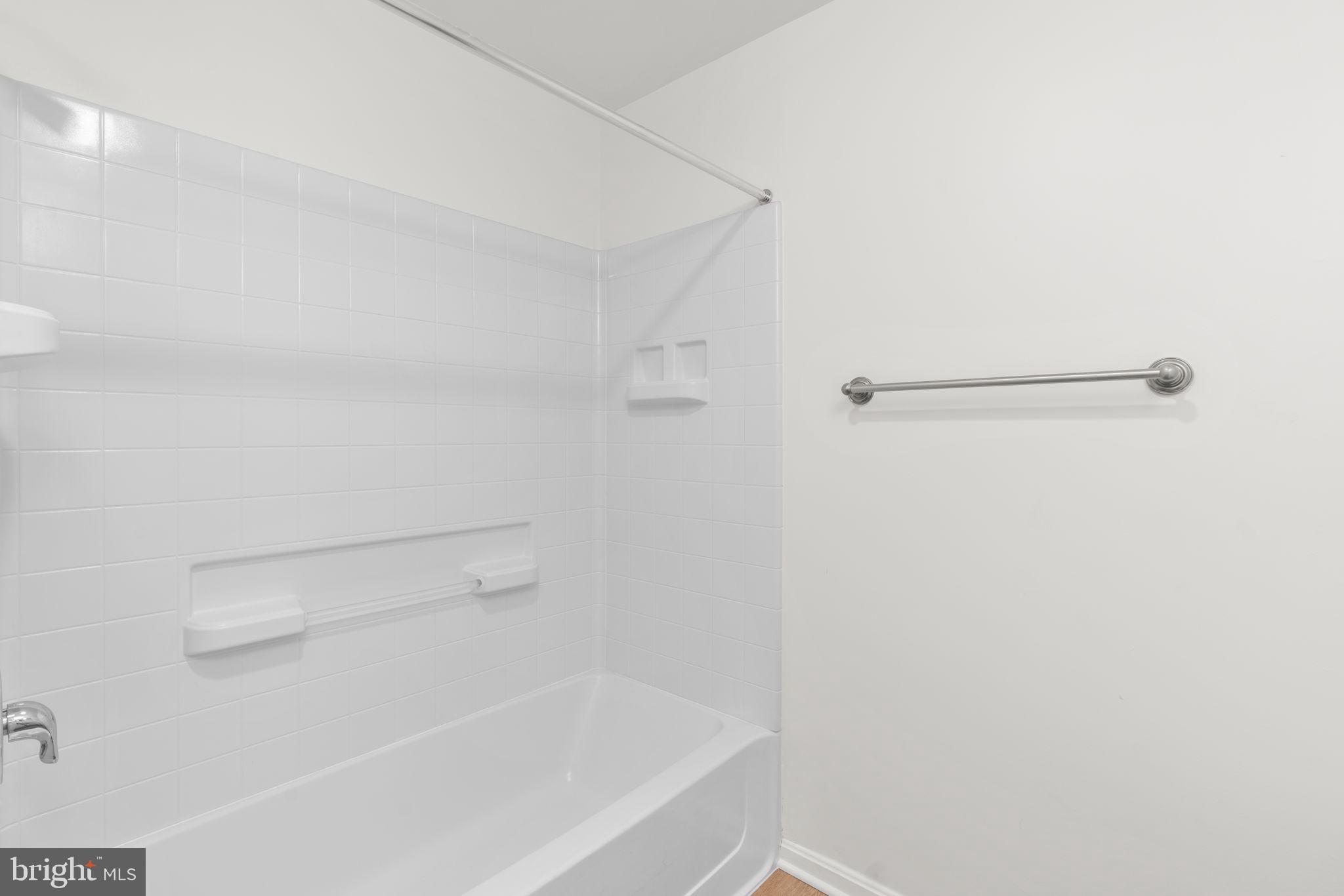 2901 South Leisure World Boulevard, Unit 233 Silver Spring, MD 20906 - Photo 27 of 43 a close up of a bathtub