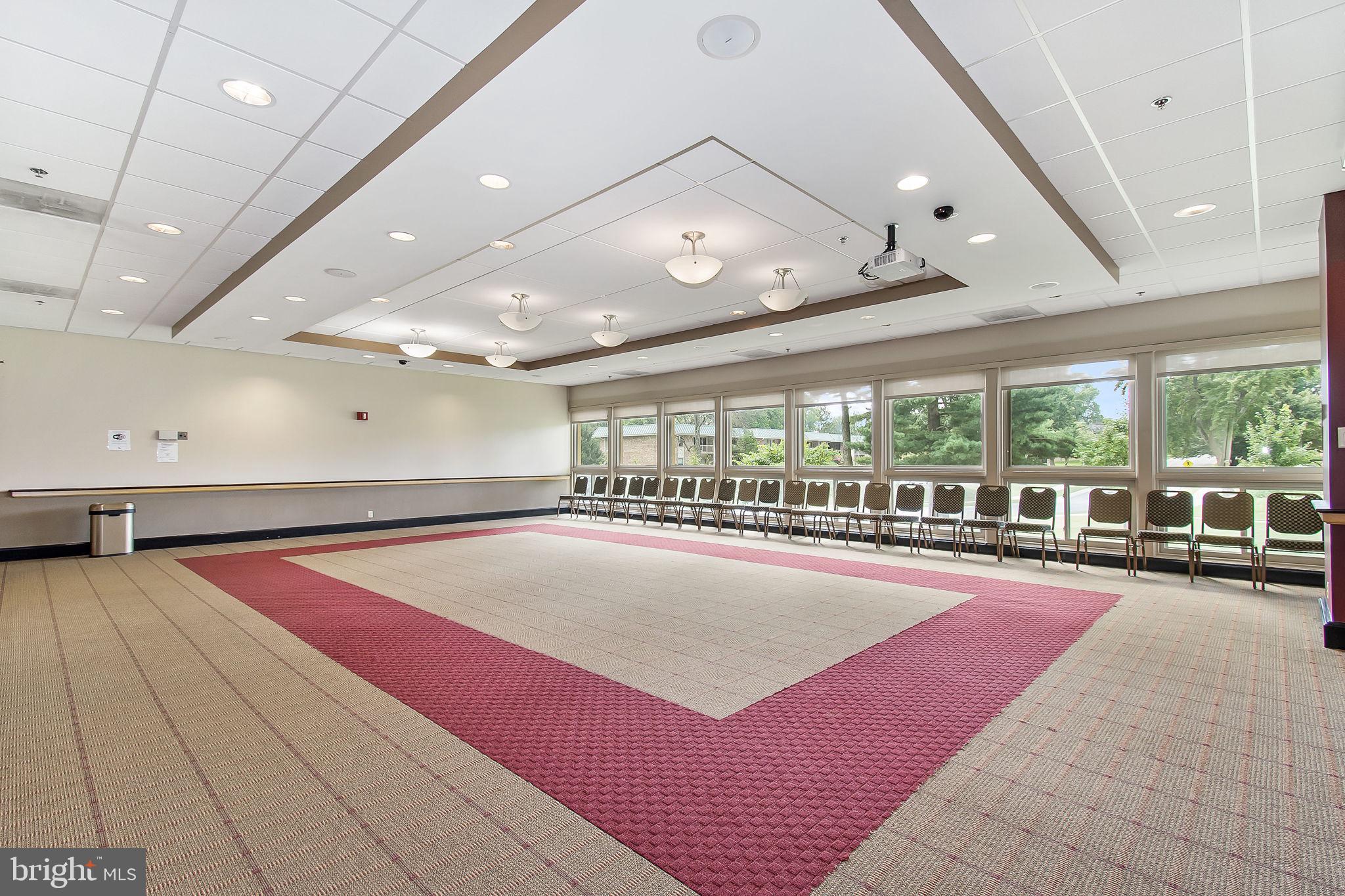 2901 South Leisure World Boulevard, Unit 233 Silver Spring, MD 20906 - Photo 39 of 43 wooden floor with pool table and large windows