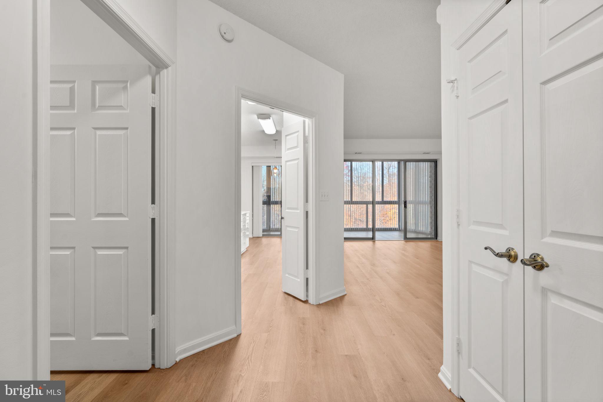 2901 South Leisure World Boulevard, Unit 233 Silver Spring, MD 20906 - Photo 5 of 44 wooden floor with white walls