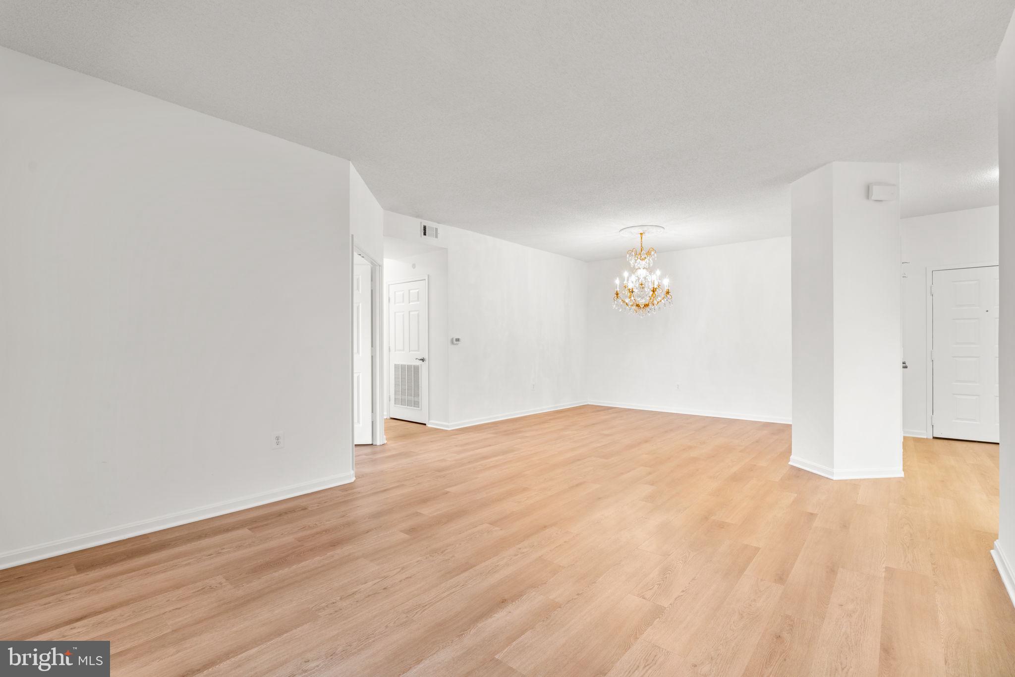 2901 South Leisure World Boulevard, Unit 233 Silver Spring, MD 20906 - Photo 6 of 43 a view of empty room with wooden floor
