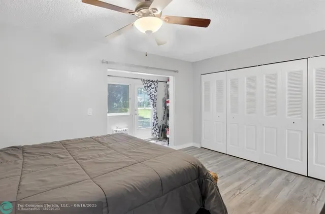 a bathroom with a toilet and a shower curtain
