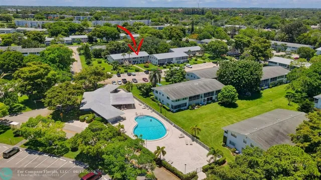 a bedroom with a bed and a flat tv screen on the dresser