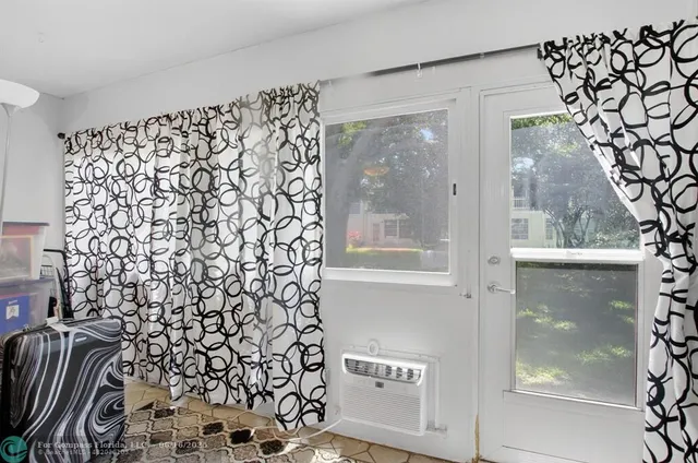 a aerial view of a house with swimming pool and a yard