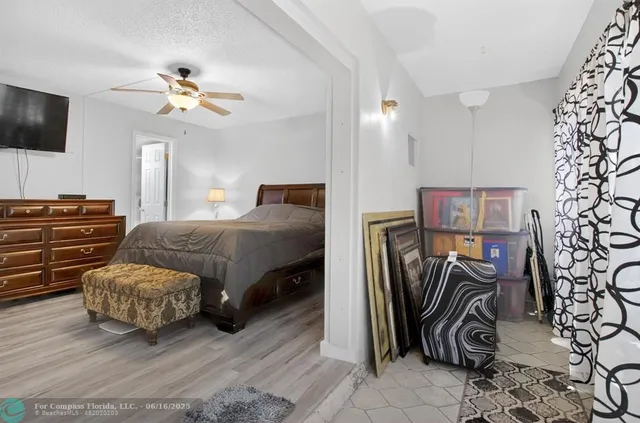 an aerial view of a houses with a yard