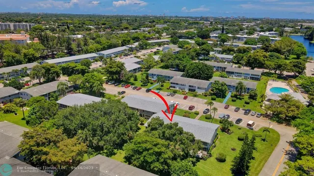 an aerial view of a house with swimming pool and outdoor space