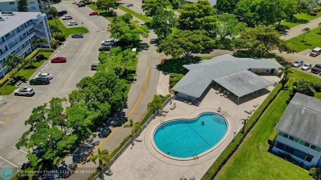 an aerial view of a house with a swimming pool