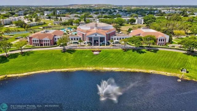 a swimming pool with outdoor seating yard and barbeque oven