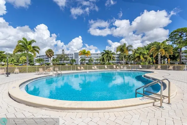 a view of a garden with a slide and a lake view