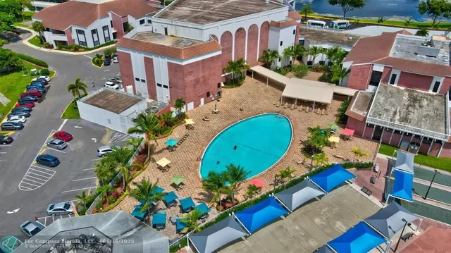 a living room with furniture and a dining table with rug